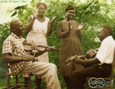 B U T C H   C A G E and W I L L I E   B.   T H O M A S with their wives (Rosie and Martha)in Zachary, Louisiana, 1960/61; source: Front cover of Arhoolie CD 372 