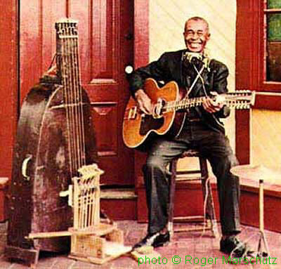 J E S S E   F U L L E R 1958 with 'fotdella' and Larson Jumbo Prairie State 12-str guitar; source: Front cover of OBCCD-526-2; photographer: Roger Marschutz)