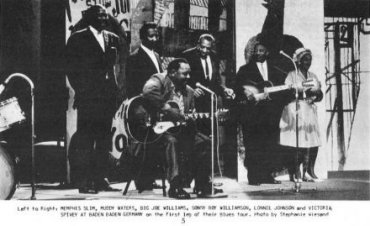 American Folk Blues Festival '63 at the Kurhaus Baden-Baden, Germany, September 29, 1963 (l to r) Bill Stepney's drums (part of them), Memphis Slim, Muddy Waters, Big Joe Williams, Sonny Boy Williamson, Lonnie Johnson, Victoria Spivey; source: Record Research 56 (November 1963), p. 5; photographer: Stephanie Wiesand