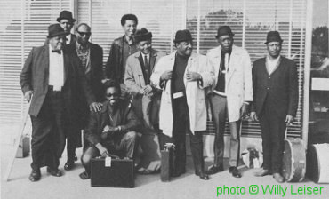 1968 AFBF ensemble: Big Joe Williams, Walter Horton, Jimmy Reed, Jessie 'J.C.' Lewis (aka Jesse Green), Jerome Arnold, Curtis Jones, Al Smith, John Lee Hooker, Eddie Taylor; photographer: ; source: Blues Unlimited 140 (Spring 1981), p. 46; photographer: Willy Leiser; click to enlarge!