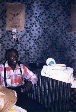 J A M E S   'K O K O M O'   A R N O L D; Kokomo Arnold in his home (4413 South Calumet Avenue) in Chicago, IL, September 1959; source: https://twitter.com/soul_bag_mag/status/1182603832980848641; photographer: Jacques Demetre