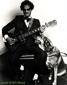 B L I N D   J O E   H I L L with his seeing-eye dog; source: http://sbblues.org/blues_albums1/blind-joe-hill; photographer: Bill Mead