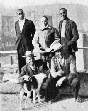 J A Z Z   G I L L U M, Tampa Red & Little Bill Gaither; sitting: Champion Jack Dupree & Big Bill Broonzy with Tampa Red's dog