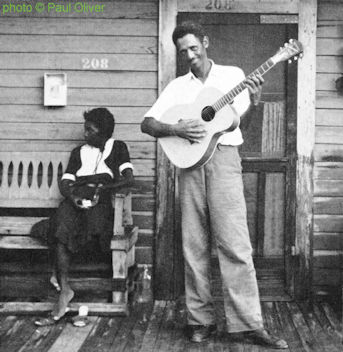 W I L L I E   N I X & his wife Patty in front of their home in Monroe, Louisiana, 1960; source: Paul Oliver: Conversation with the Blues (The Jazz Book Club, 1967), photo #73, photo pp. between pp. 164 and 165; photographer: Paul Oliver; click to enlarge!