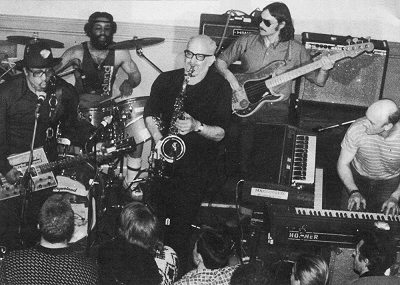 Bo Diddley and Mainsqueeze London, March 1984; left to right: Bo Diddley, 'Stretch', Dick Heckstall-Smith, Keith Tillman, Dave 'Munch' Moore; source: Blues Unlimited 148/149 (Winter 1987), p. 52; photographer: George White; click to enlarge!