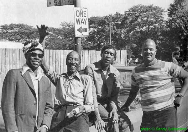 J.B. Hutto, H O U N D   D O G   T A Y L O R, Brewer Phillips & Ted Harvey outside Florence's Lounge, Chicago, Illinois; source: David Harrison: Die Legenden des Blues - Eine Hommage in Bildern.- Königswinter, Germany (HEEL-Verlag) 1995, p. 108; photographer's name not given ('courtesy of Blues Unlimited') [actually Sandy Sutherland]