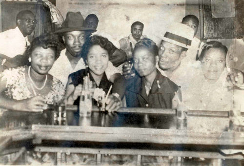 Muddy Waters, Viola Spearman (Koko Taylor's Sister), Levi Walton (Koko Taylor's Brother), Otis Spann, Vera Walton (Levi Walton's Wife), Elga Edmonds, Koko Taylor, Robert Taylor, Jimmy Rogers, Savannah Becton (Koko Taylor's Sister) at Silvio's Lounge, mid 1950s; source: Koko Taylor Collection, courtesy of Alligator Records - Tim Kolleth