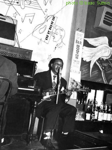 Muddy Waters at 708 Club, Chicago, ca. 1953; source: EBONY and JET magazine collection; photographer: Isaac Sutton